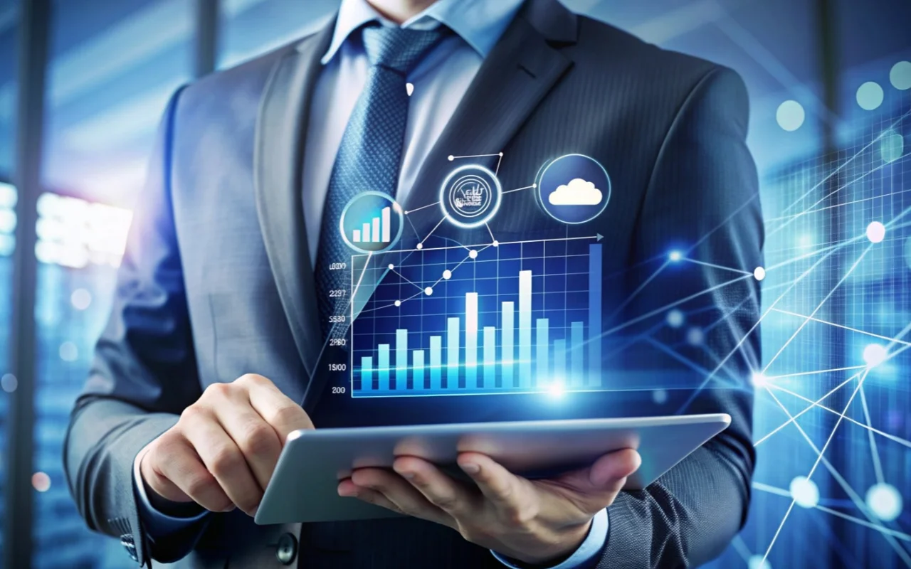 Homem de terno usando tablet com gráficos de crescimento e ícones de nuvem, ilustrando um conteúdo da Ramo sobre preço SAP Business One.